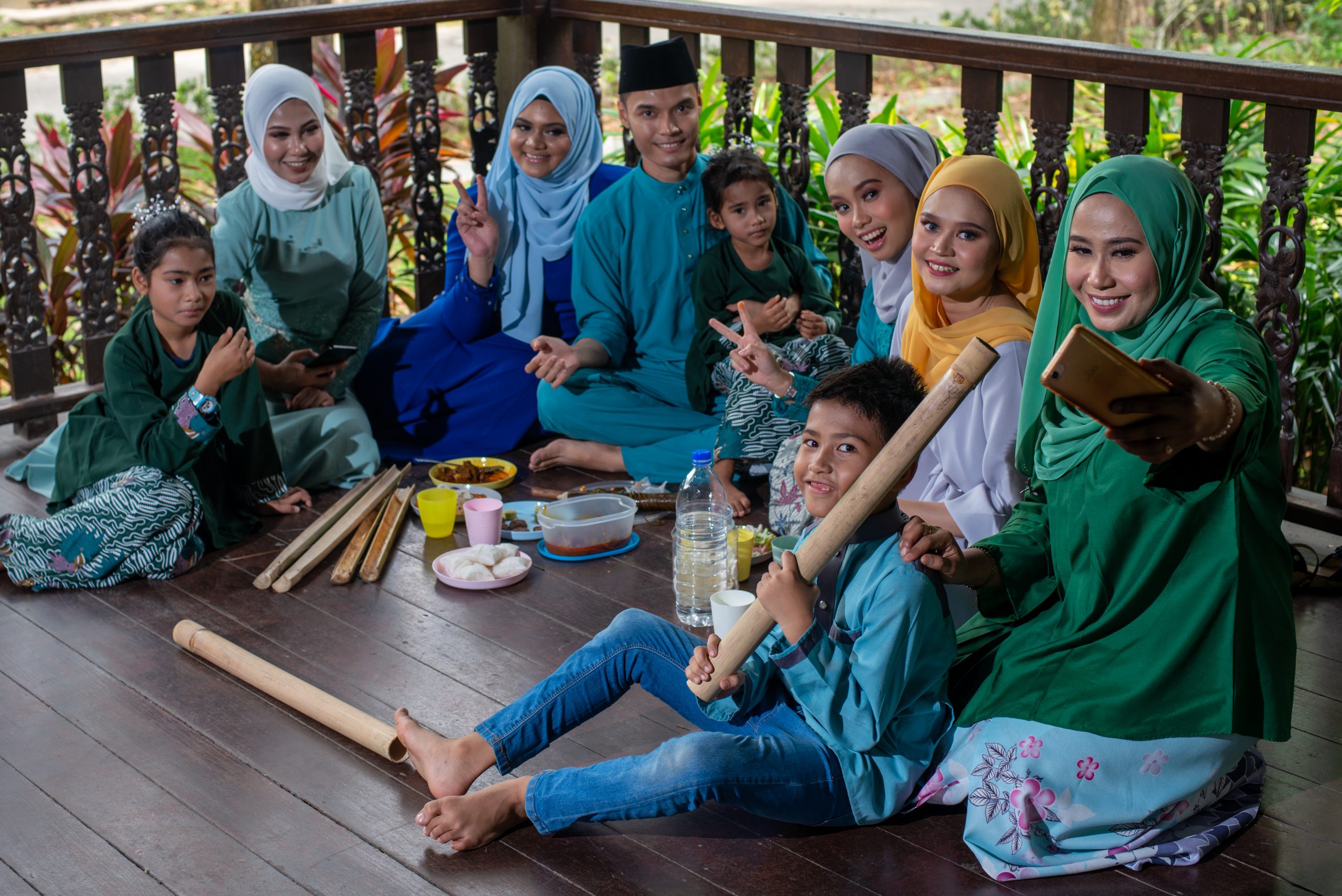 https://senangweb.com.my/demo-utl/wp-content/uploads/2024/12/people-sit-down-floor-malay-wooden-house-having-meal-eid-traditional-clothing-scaled.jpg